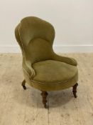 A Victorian walnut framed spoon back drawing room chair, upholstered in green / yellow velvet,