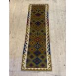 A Maimana kilim runner rug of typical geometric design with running dog border, 295cm x 89cm