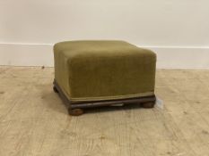 A Victorian stained walnut footstool with upholstered top and bun supports H24cm, W37cm