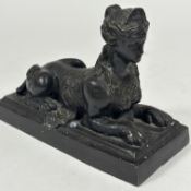 A 19thc French black enamel patinated cast brass door stop in the form of a Sphinx mounted on