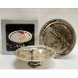 A boxed silver plated cake stand with engraved design and gadrooned edge (h- 10.5cm, w- 32cm),
