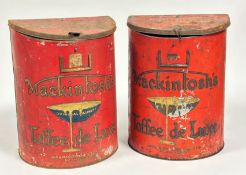 A pair of large display Mackintosh's Toffee De Luxe red tins with clip lids decorated with relief