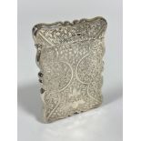 An Edwardian Sheffield silver Walker & Hall card case of rectangular scalloped form, with all over