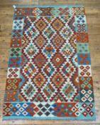 A Chobi kilim rug of overall geometric design, 190cm x 124cm