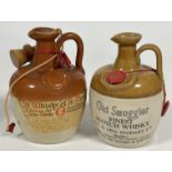 A sealed stoneware jug containing Donald Fisher Ltd Edinburgh a Curious old Whisky of Ye Old