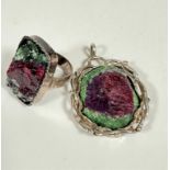 A Scottish silver mounted green and plum set pyrite open work ball mounted pendant, (4.5cm x 3cm)