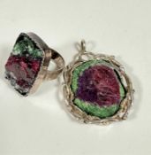 A Scottish silver mounted green and plum set pyrite open work ball mounted pendant, (4.5cm x 3cm)