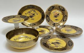 A Solian Ware part-service by Soho Pottery decorated in yellow/gilt with birds and sunset in the