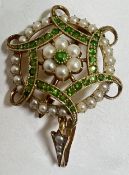 An Edwardian 15ct gold pendant brooch, the centre, set a green dematoid garnet within a surround of