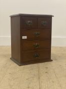 An early 20th century mahogany table top collectors chest, fitted with two short and three long