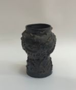 An abstract wheel-thrown baluster form studio/art pottery vase with applied and pierced