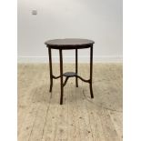 An Edwardian mahogany centre table, the circular top with chequered string inlay, raised on