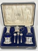 A cased Birmingham five piece condiment set of flared cylinder form with drum mustard with blue