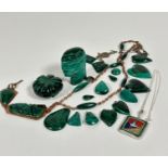 A collection of malachite including a carved bust (6cm), a circular pumpkin paperweight (5cm), heart