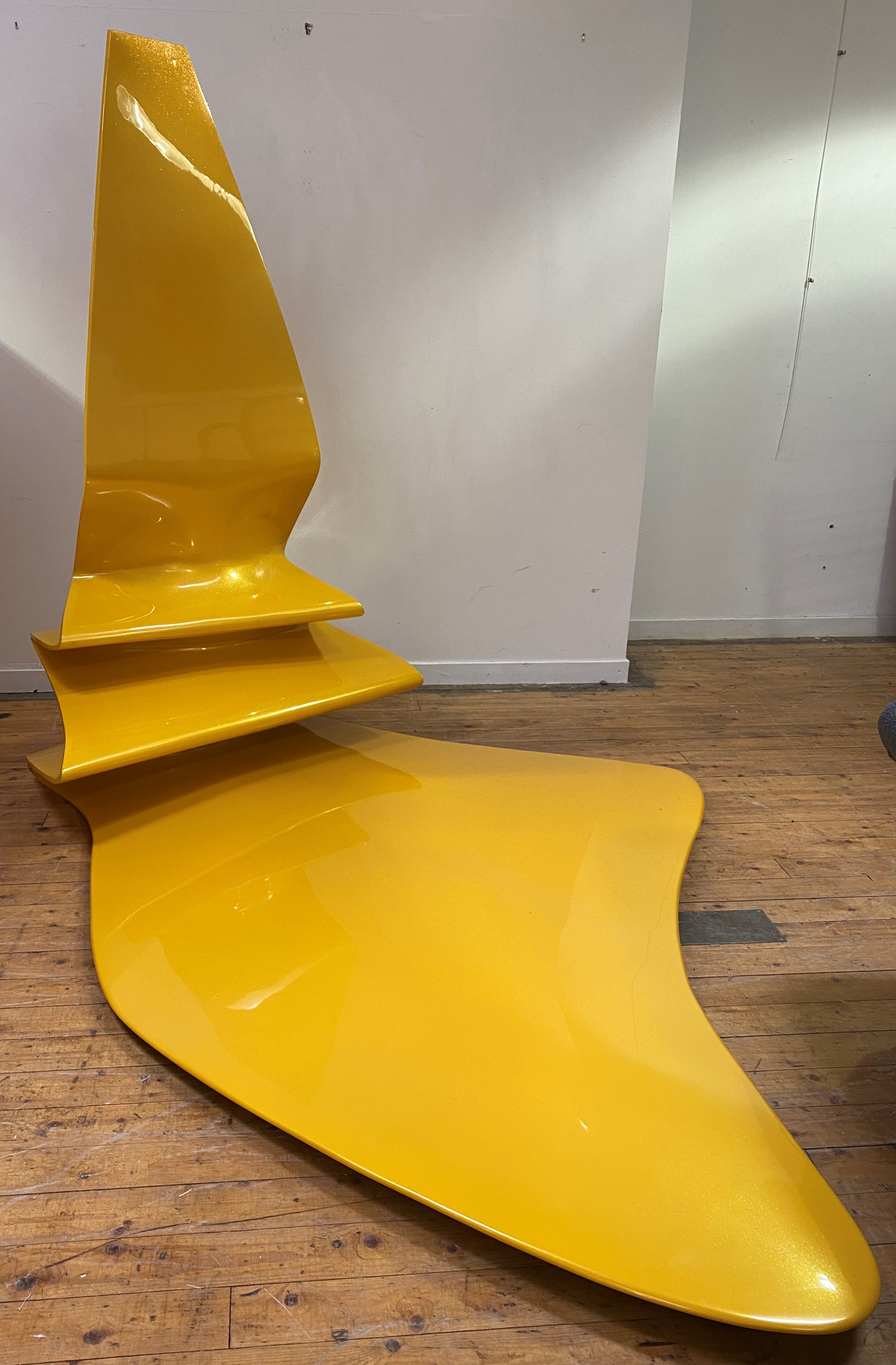 A large abstract fibreglass sculpture, vaguely formed as whisky flowing in to a puddle, recently