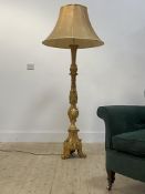A late 20th century gilt composition standard lamp in the Rococo taste in the form of a candlestick,