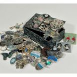 A Koha Abalone shell mounted box containing a large collection of shell mounted white metal and