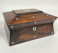 A Victorian rosewood mother of pearl inlaid sarcophagus shaped work box, the hinged to enclosing a