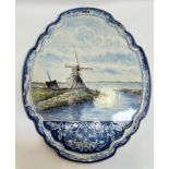 A large nineteenth century Delft Makkum tin-glazed pottery wall plaque with polychrome scene of a