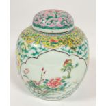 A late 19thc Chinese ginger jar and cover decorated in famille rose design with lotus panels