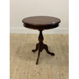 A Victorian style mahogany tripod table, circular moulded top over turned column and triple splay