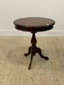 A Victorian style mahogany tripod table, circular moulded top over turned column and triple splay