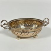 A 19th/ early 20thc Continental white metal sugar bowl with beaded border and twin C scroll