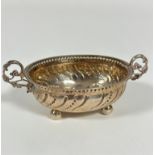 A 19th/ early 20thc Continental white metal sugar bowl with beaded border and twin C scroll