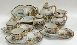 A Japanese eggshell porcelain tea/coffee service decorated with enamelled scenes of ladies and
