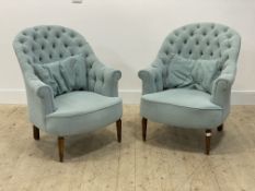 A pair of Victorian style tub chairs, well upholstered in sky blue buttoned fabric, with