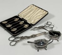 A collection of Epns including a pair of grapes scissors, a pair of candle snuffers, a salt seller