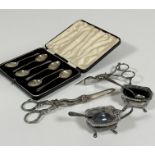 A collection of Epns including a pair of grapes scissors, a pair of candle snuffers, a salt seller