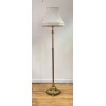 An early 20th century cast brass telescopic lamp standard, the reeded column over circular gadrooned