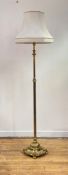 An early 20th century cast brass telescopic lamp standard, the reeded column over circular gadrooned