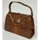 A Vintage 1930-50's Python skin hand bag with snap closure to top and three interior compartments