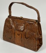 A Vintage 1930-50's Python skin hand bag with snap closure to top and three interior compartments