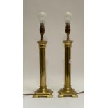 A pair of gilt brass table lamps formed as plain columns, H42cm