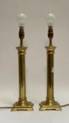 A pair of gilt brass table lamps formed as plain columns, H42cm