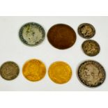 A collection of coins including a Queen Victoria gold half sovereign 1887, an Edward the VII gold