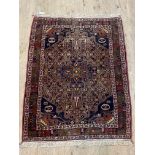 A hand knotted Persian rug of overall geometric design, 155cm x 144cm