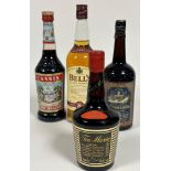 A group of spirits and liqueurs to include a bottle of Bells Extra Special eight year old blended