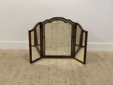 A 1930's walnut framed triptych vanity mirror of 18th century design, with undulating and moulded