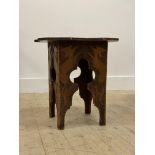 An early 20t century pine lamp table with pokerwork decoration H47cm, W47cm