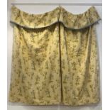 A embroidered cotton lined single curtain, the fabric worked in a floral design