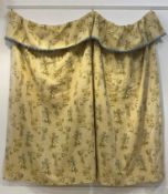 A embroidered cotton lined single curtain, the fabric worked in a floral design