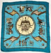 A Vintage Hermes Paris Carrossier silk scarf by LeDoux in shades of cream, tan and teal, signed