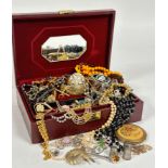 A jewellery box containing a collection of costume jewellery including a gilt metal hinged bangle,