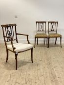 A set of three Edwardian satinwood inlaid mahogany side chairs, with upholstered seats, raised on