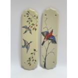 A pair of hand painted ceramic finger plates decorated with birds and foliage (h- 28cm w-7.5cm) (2)