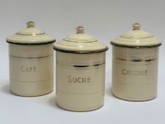 A trio of cream coloured enamel storage jars with cover, titles in gold including Cafe, Sucre and